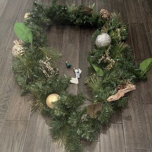 Festive Green Holiday Garland with Gold Accents and lights